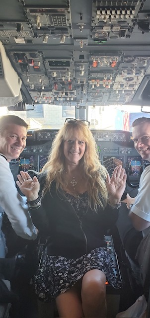  A group photo inside a cockpit during a Just Believe Foundation initiative