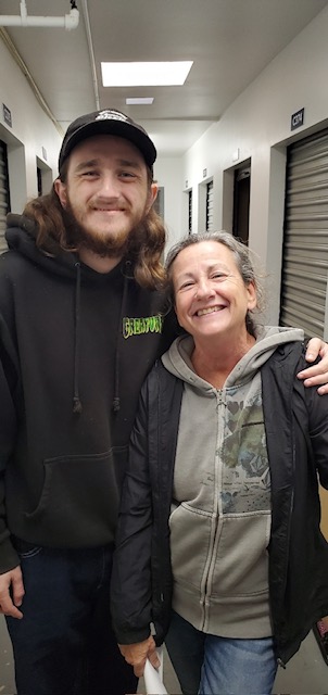 Two individuals posing for a picture at a nonprofit event