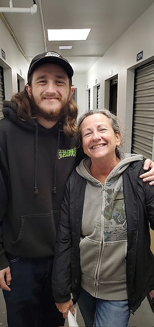 Two individuals posing for a picture at a nonprofit event