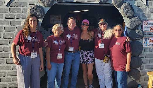 A group of people wearing matching t-shirts at a foundation event