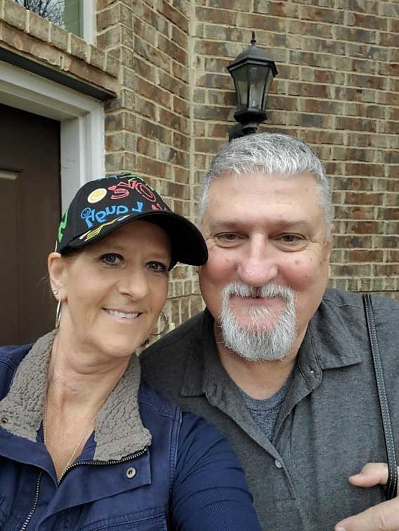 A couple standing together at a foundation gathering